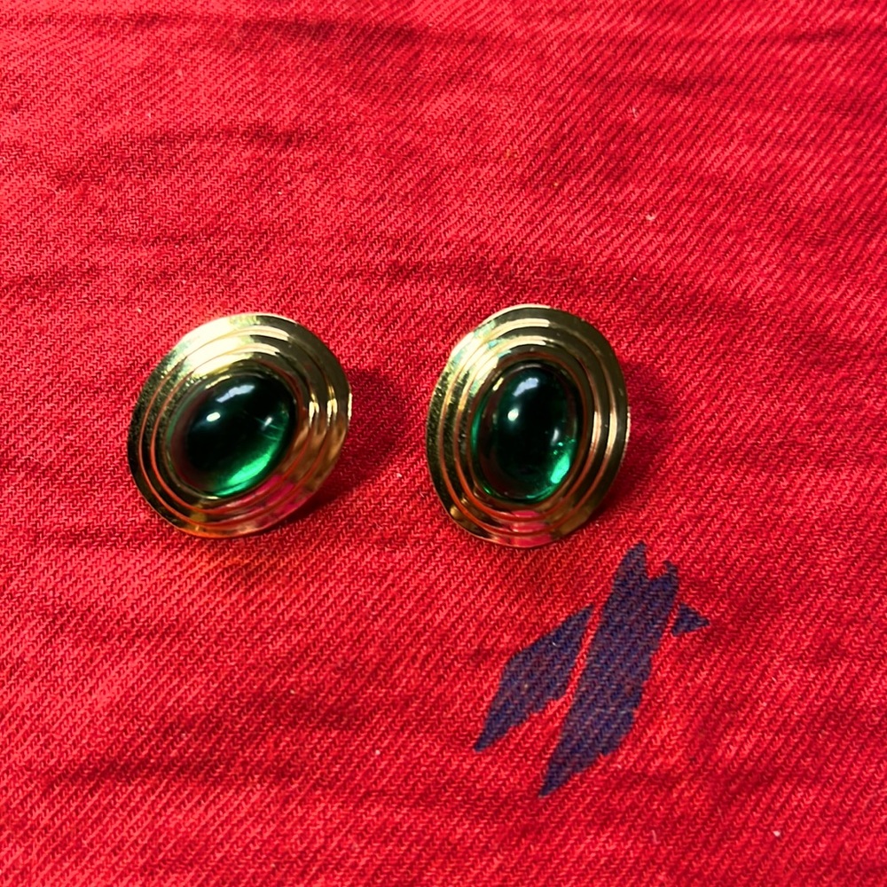Nice pair of custom earrings in gold tone and green stone in the center